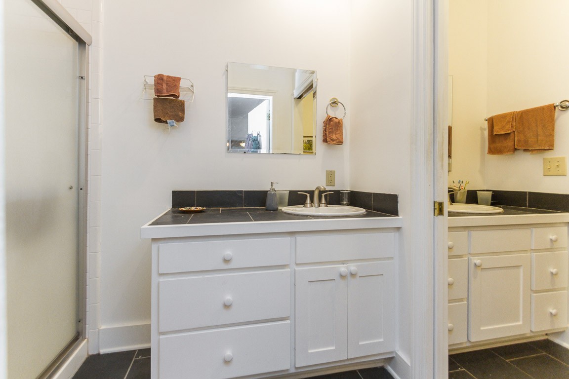 1033 Eva Lake Road Sewanee, TN 37375 - Photo 29 of 49 a bathroom with a sink and a mirror