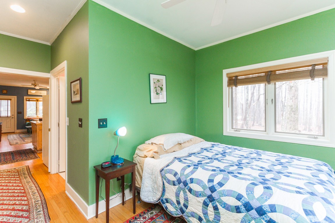 1033 Eva Lake Road Sewanee, TN 37375 - Photo 31 of 49 a bedroom with a bed and windows