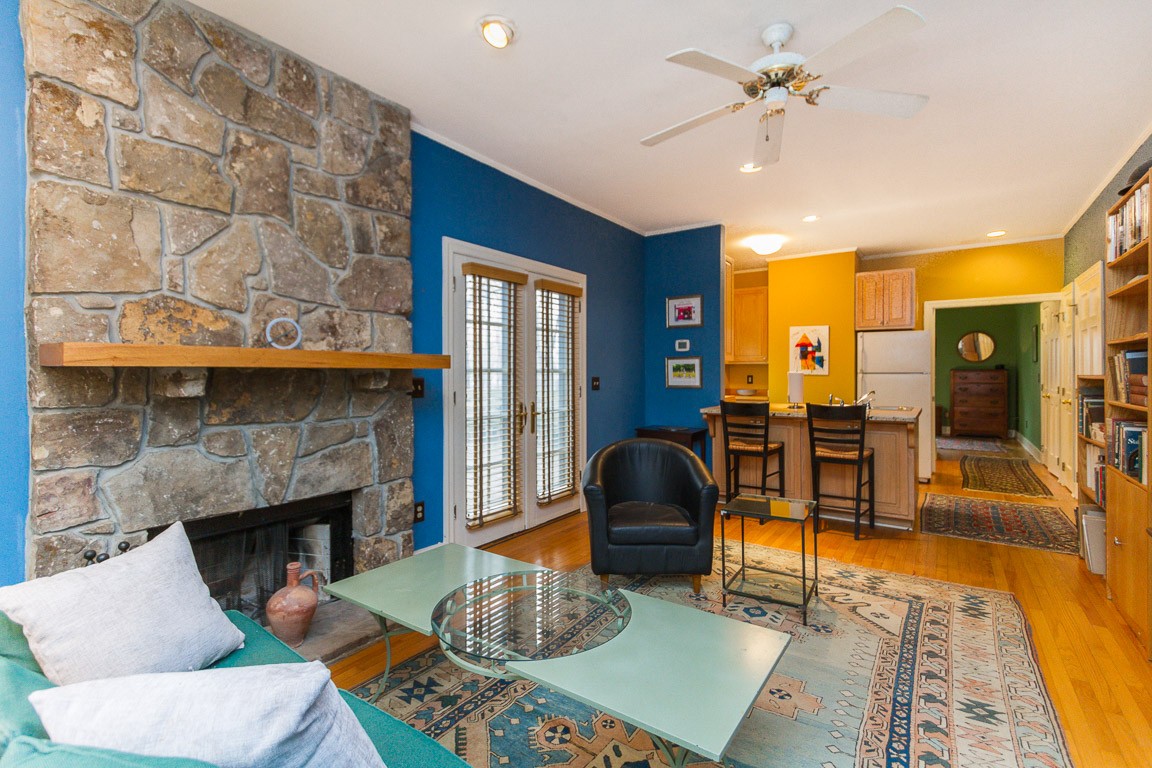 1033 Eva Lake Road Sewanee, TN 37375 - Photo 34 of 49 a living room with furniture and a fireplace
