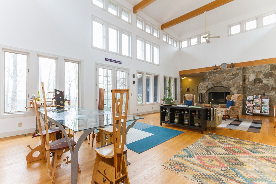 1033 Eva Lake Road Sewanee, TN 37375 - Photo 10 of 49 a living room with furniture pool view and large windows