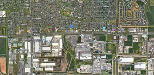 a aerial view of a house with a yard and lake view