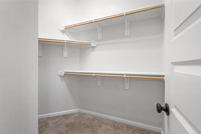 a view of an empty walk in closet