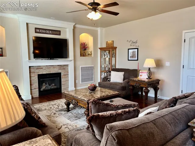 a living room with furniture and kitchen view
