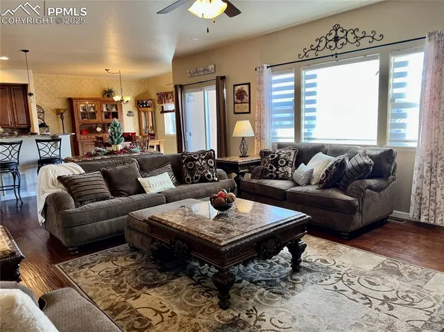 a view of a dining room with furniture window and wooden floor