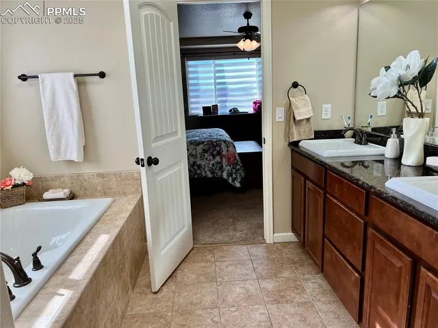 a living room with a bed furniture and a window