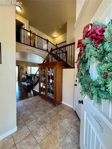 a living room with furniture fireplace and flat screen tv