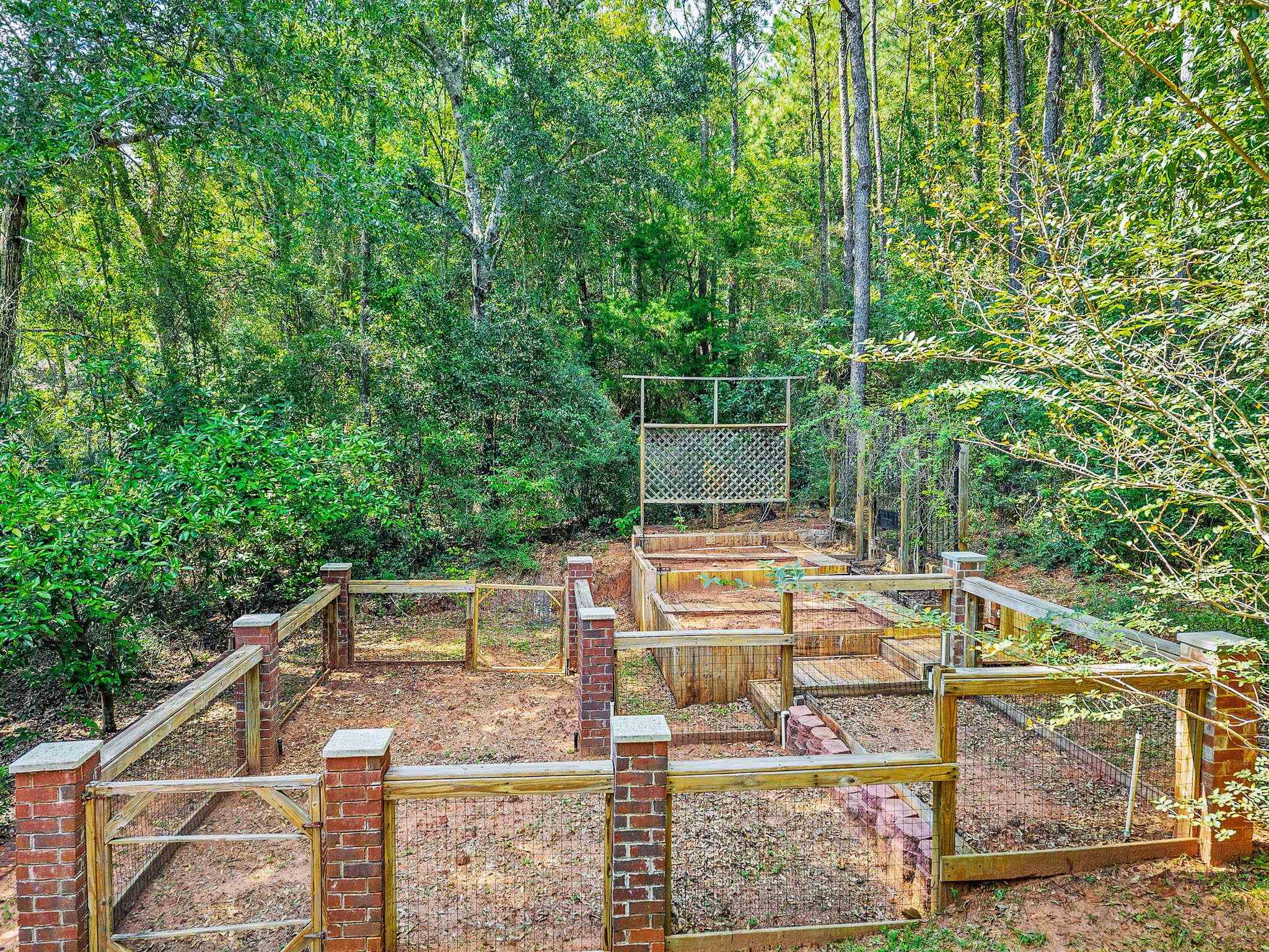 8955 North Lamhatty Lane Daphne, AL 36526 - Photo 68 of 73 Mulit-tier fenced gardem