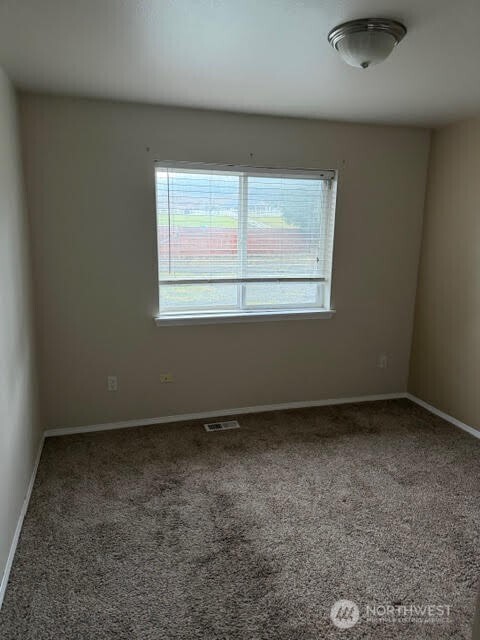 502 366th St Court South Roy, WA 98580 - Photo 12 of 25 an empty room with a window