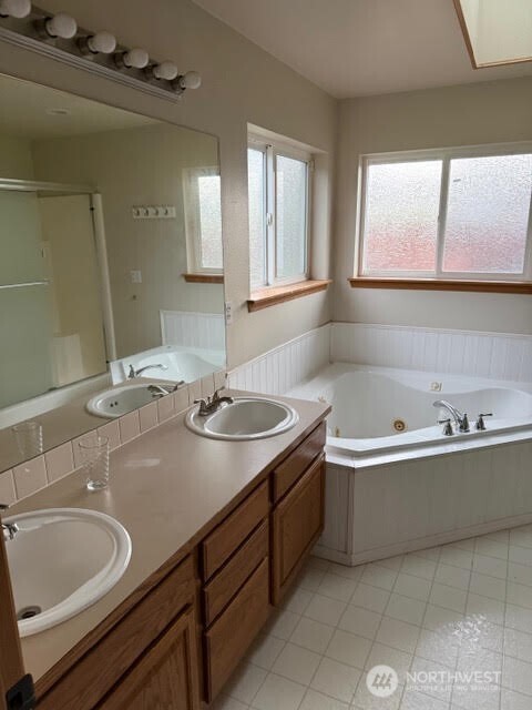 502 366th St Court South Roy, WA 98580 - Photo 14 of 25 a bathroom with a sink and a bathtub
