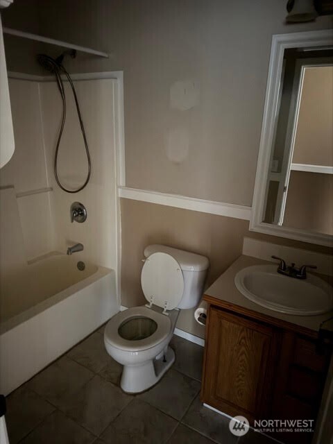 502 366th St Court South Roy, WA 98580 - Photo 15 of 25 a bathroom with a toilet a sink and a shower