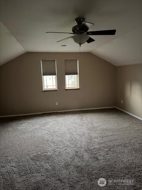 502 366th St Court South Roy, WA 98580 - Photo 18 of 25 an empty room with a ceiling fan and windows