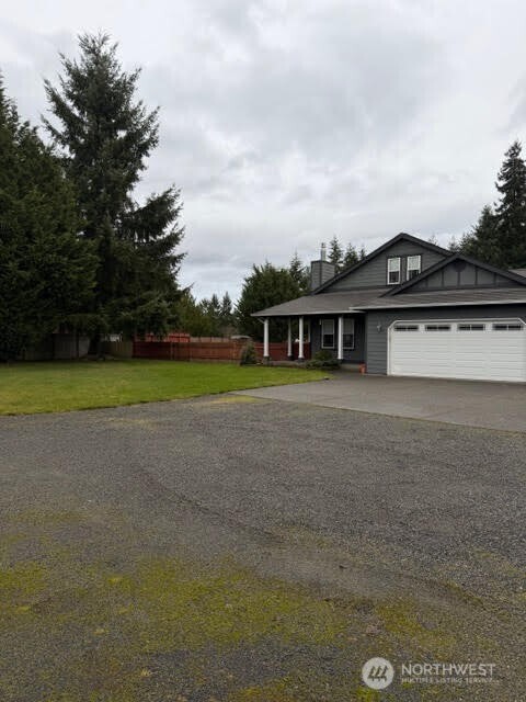 502 366th St Court South Roy, WA 98580 - Photo 2 of 25 a view of a house with a backyard and a yard