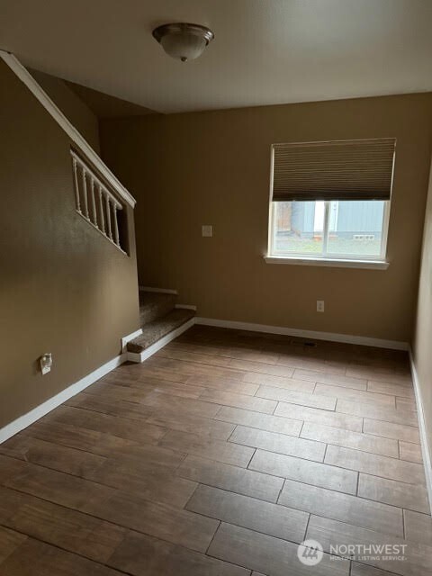 502 366th St Court South Roy, WA 98580 - Photo 21 of 25 a view of an empty room with a window