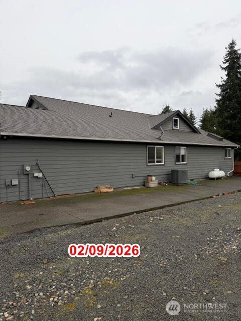 502 366th St Court South Roy, WA 98580 - Photo 6 of 25 a front view of a house with a yard