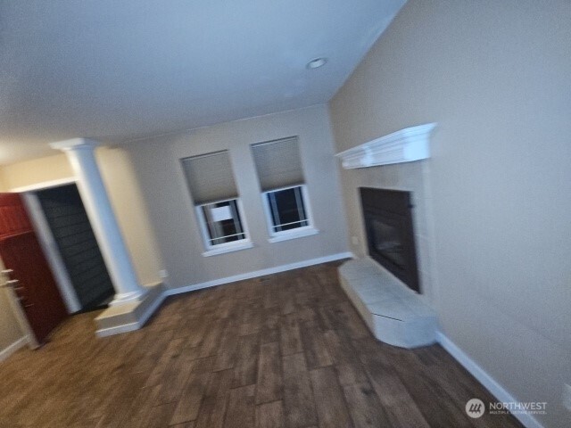 502 366th St Court South Roy, WA 98580 - Photo 7 of 25 a view of a livingroom with wooden floor and staircase