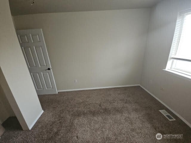 502 366th St Court South Roy, WA 98580 - Photo 10 of 25 an empty room with a window