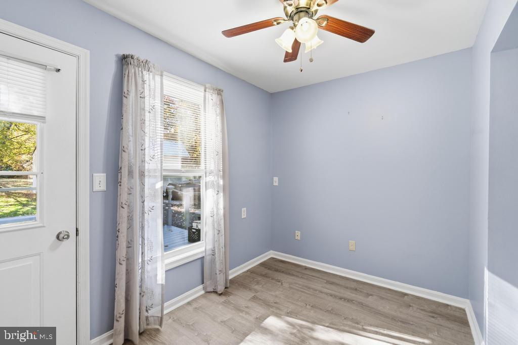 1326 Perrys Corner Road Grasonville, MD 21638 - Photo 15 of 35 an empty room with windows and entrance