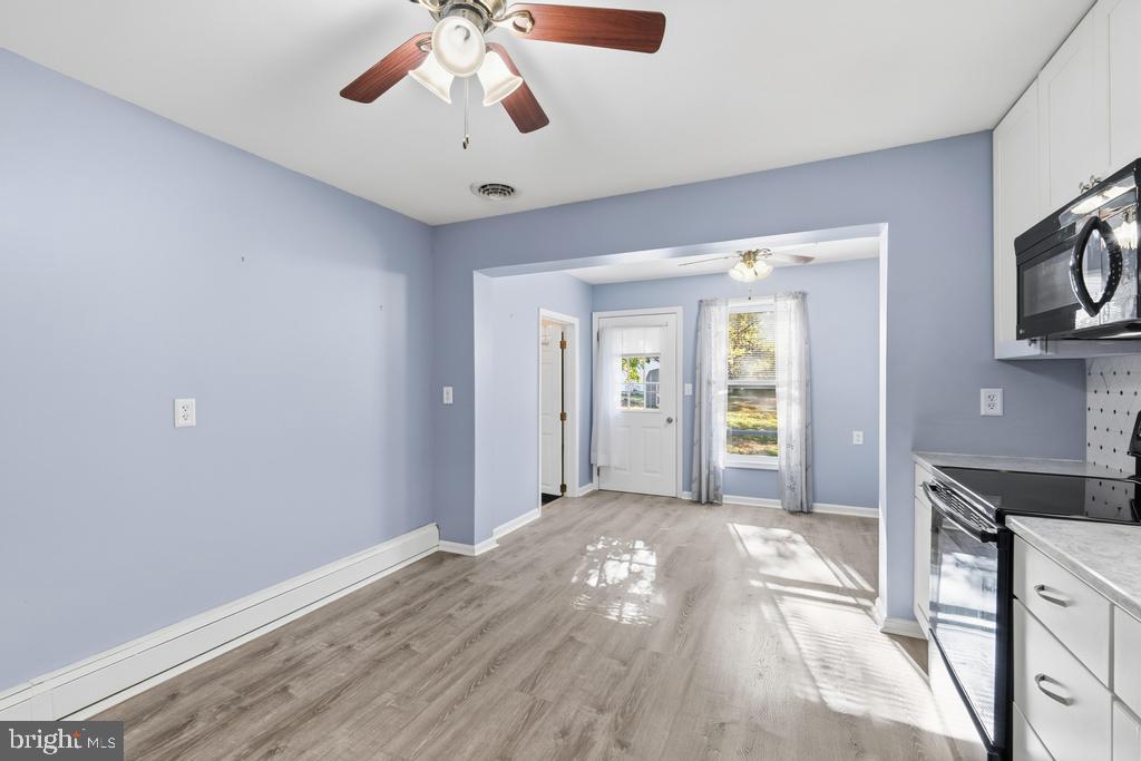1326 Perrys Corner Road Grasonville, MD 21638 - Photo 17 of 35 a view of a livingroom with a kitchen