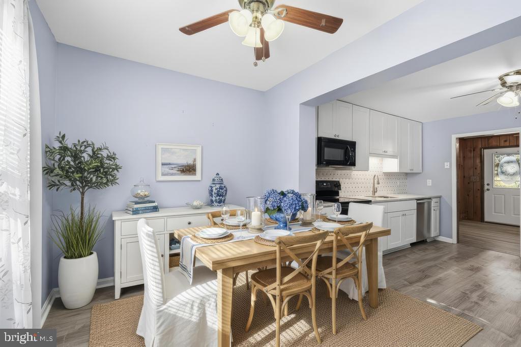 1326 Perrys Corner Road Grasonville, MD 21638 - Photo 2 of 35 a view of a dining room with furniture window and wooden floor