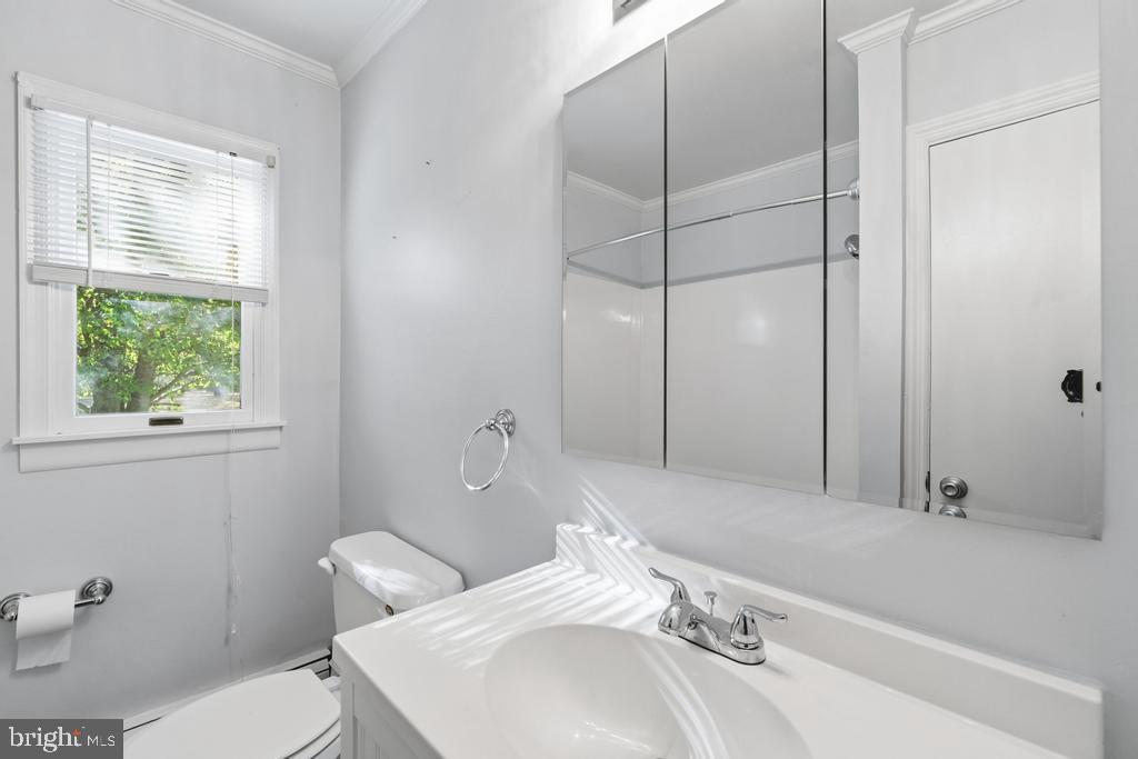 1326 Perrys Corner Road Grasonville, MD 21638 - Photo 23 of 35 a bathroom with a sink a toilet and shower