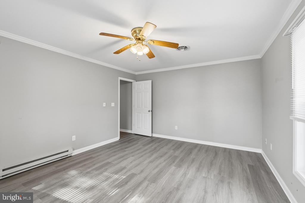 1326 Perrys Corner Road Grasonville, MD 21638 - Photo 32 of 35 wooden floor in an empty room