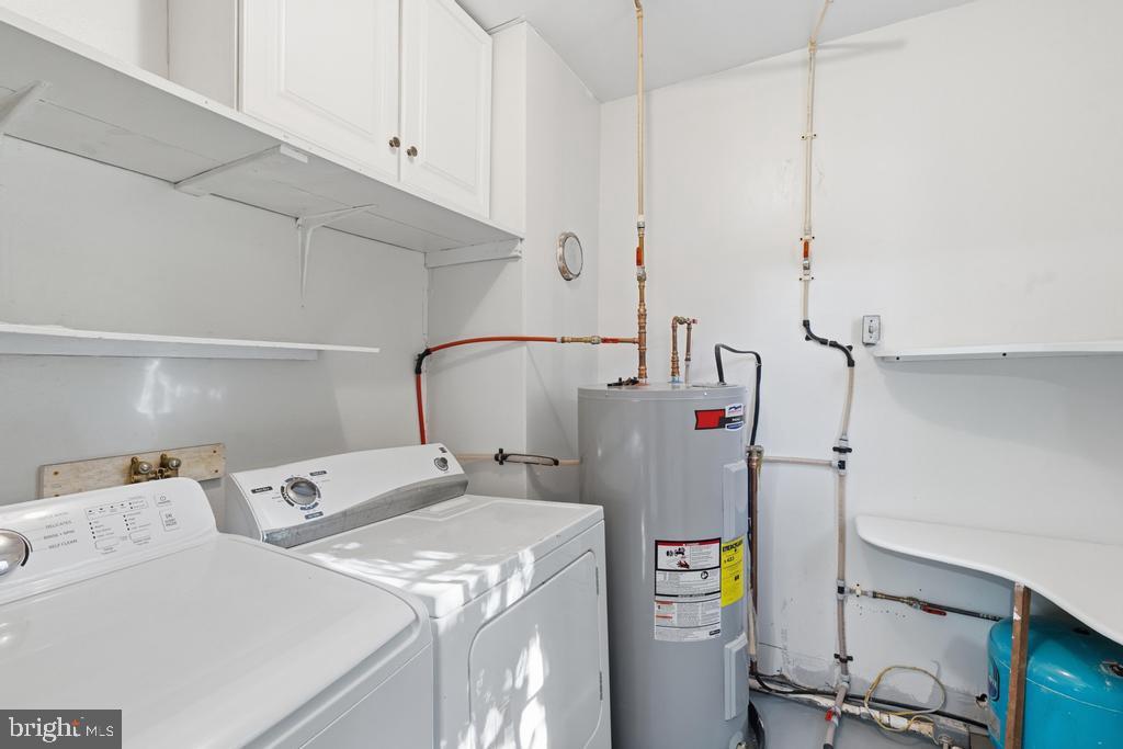 1326 Perrys Corner Road Grasonville, MD 21638 - Photo 33 of 35 a utility room with dryer and washer