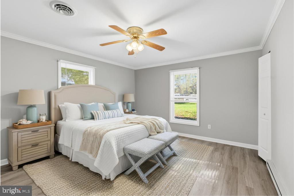 1326 Perrys Corner Road Grasonville, MD 21638 - Photo 5 of 35 a bedroom with a bed and a window