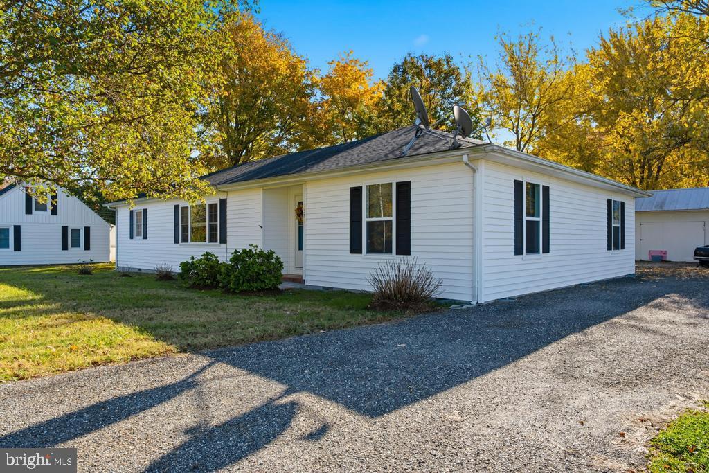 1326 Perrys Corner Road Grasonville, MD 21638 - Photo 7 of 35 a front view of a house with garden