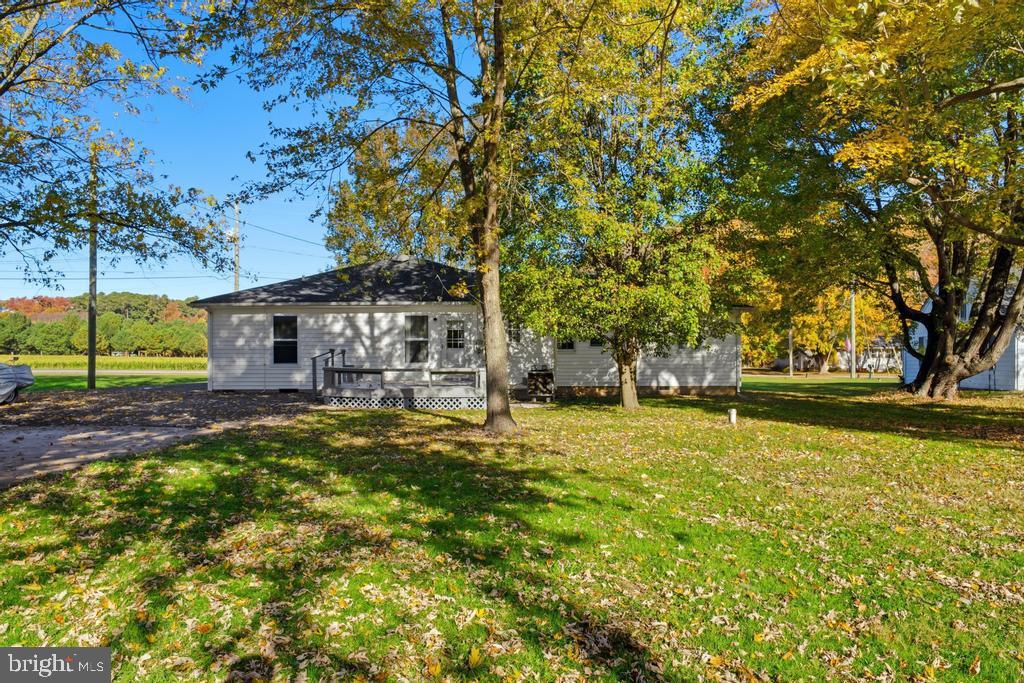 1326 Perrys Corner Road Grasonville, MD 21638 - Photo 9 of 35 a view of a house with pool and tree s
