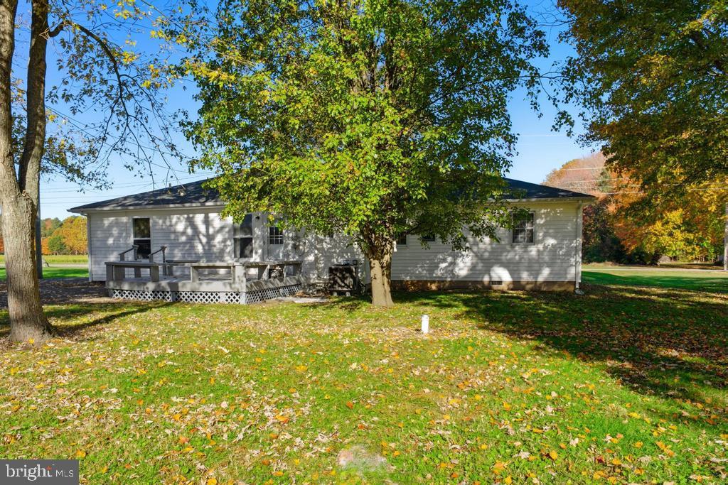 1326 Perrys Corner Road Grasonville, MD 21638 - Photo 10 of 35 a view of swimming pool with lawn chairs and plants
