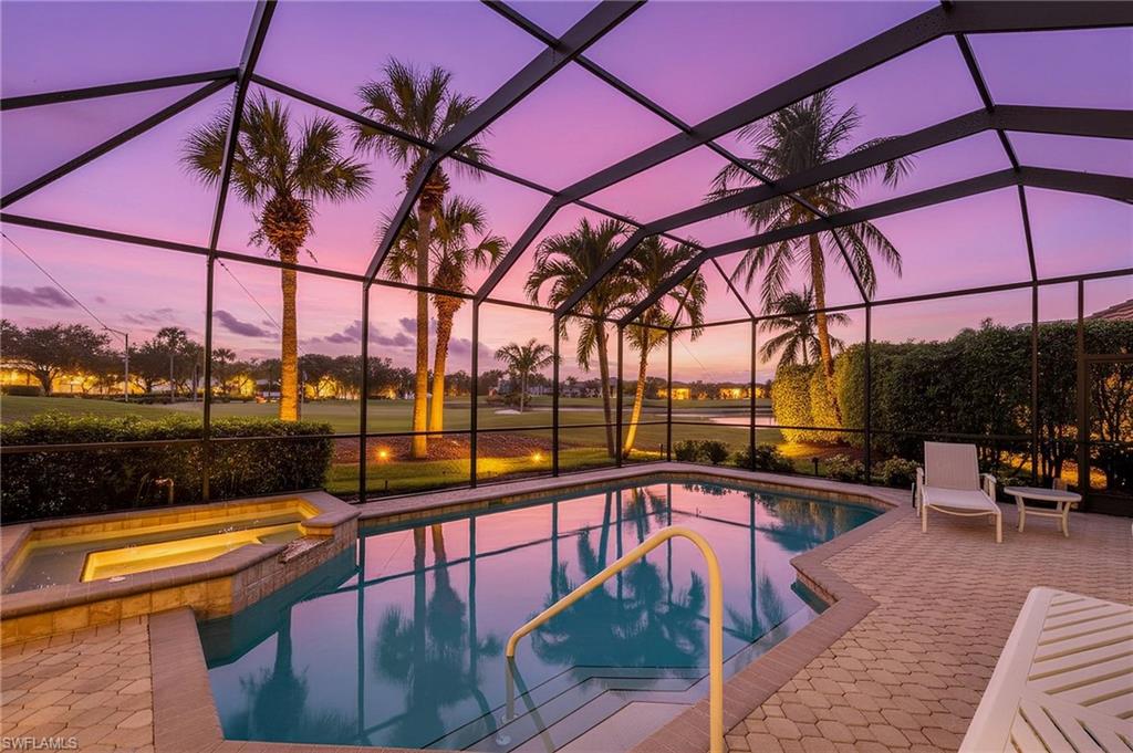 a view of a swimming pool with a lounge chairs