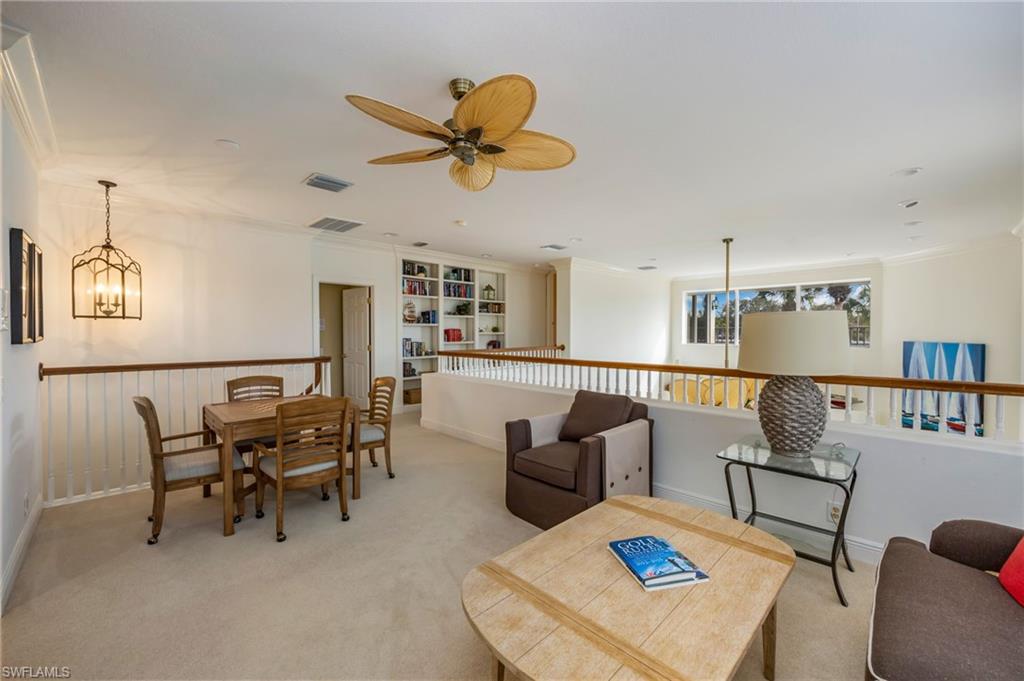 6012 Fairway Court Naples, FL 34110 - Photo 12 of 38 a living room with furniture and a view of kitchen