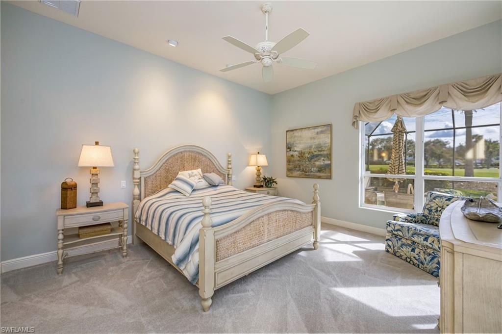 6012 Fairway Court Naples, FL 34110 - Photo 13 of 38 a bedroom with bed and a large window