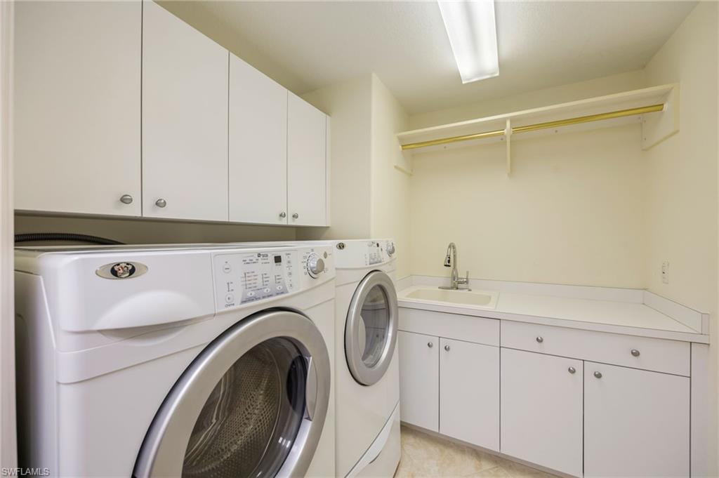 6012 Fairway Court Naples, FL 34110 - Photo 21 of 38 a utility room with dryer and washer