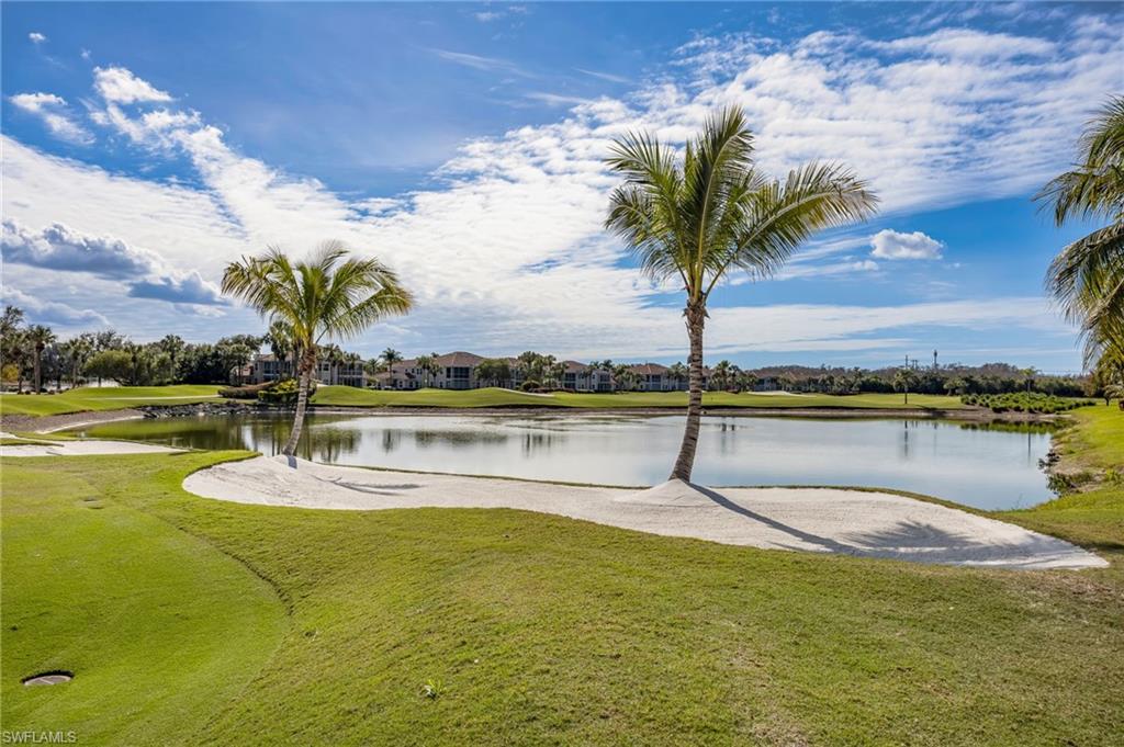 6012 Fairway Court Naples, FL 34110 - Photo 24 of 38 a swimming pool with a lawn chairs