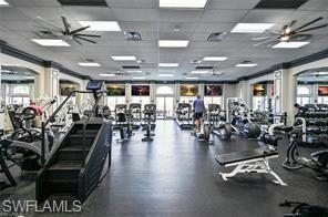 6012 Fairway Court Naples, FL 34110 - Photo 27 of 38 a view of a room with gym equipment