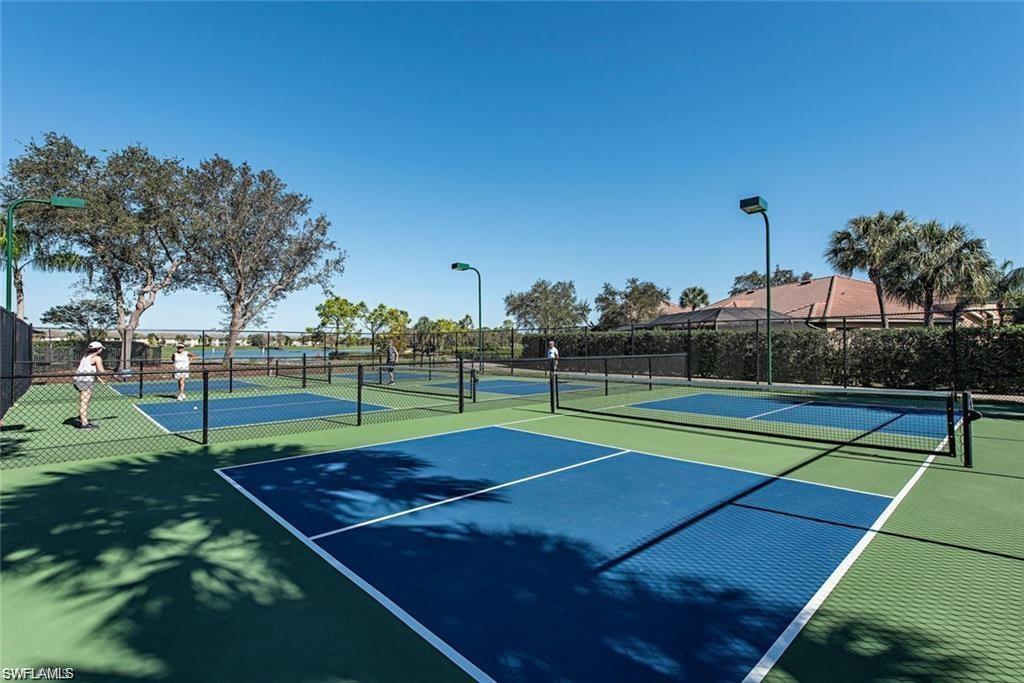 6012 Fairway Court Naples, FL 34110 - Photo 29 of 38 a tennis court that has tennis net