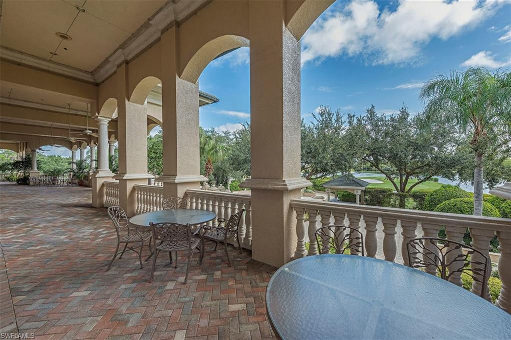 6012 Fairway Court Naples, FL 34110 - Photo 33 of 38 a view of a chair and tables in the balcony