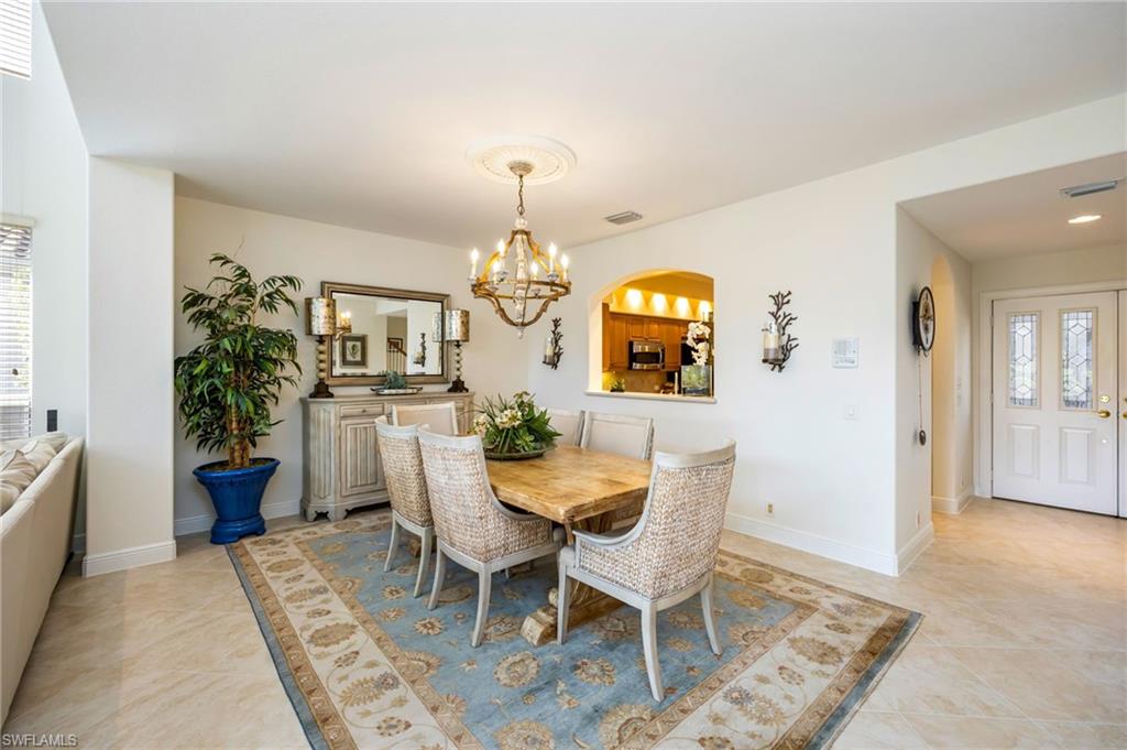 6012 Fairway Court Naples, FL 34110 - Photo 9 of 38 a view of a dining room with furniture