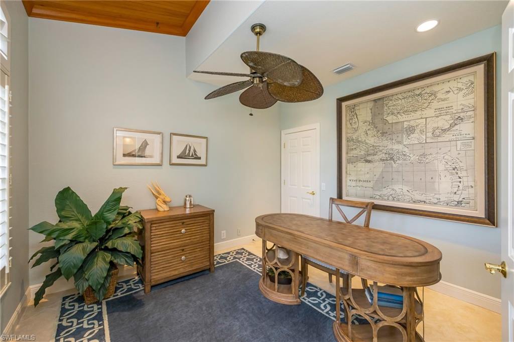 6012 Fairway Court Naples, FL 34110 - Photo 10 of 38 a dining room with furniture and window