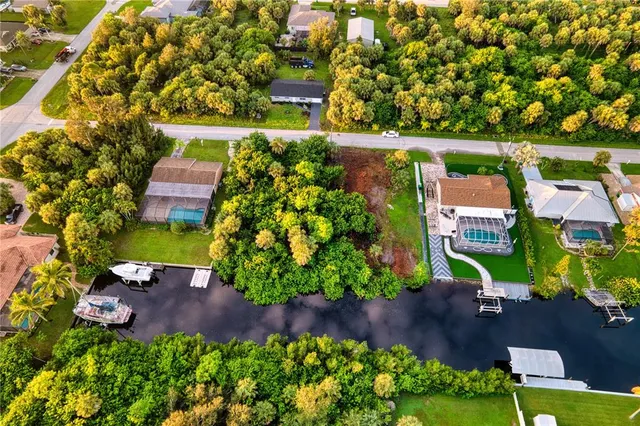 an aerial view of a house with a garden and yard