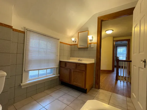 a bathroom with a sink a mirror and a shower