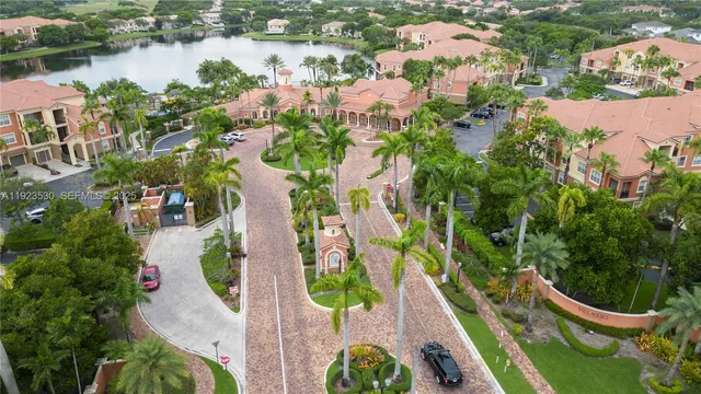 an aerial view of residential house with outdoor space and lake view