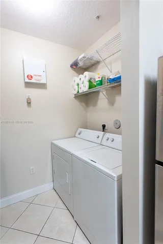 a bathroom with a sink a toilet a mirror and shower curtain