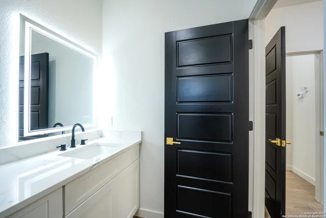 a kitchen with a refrigerator and a sink