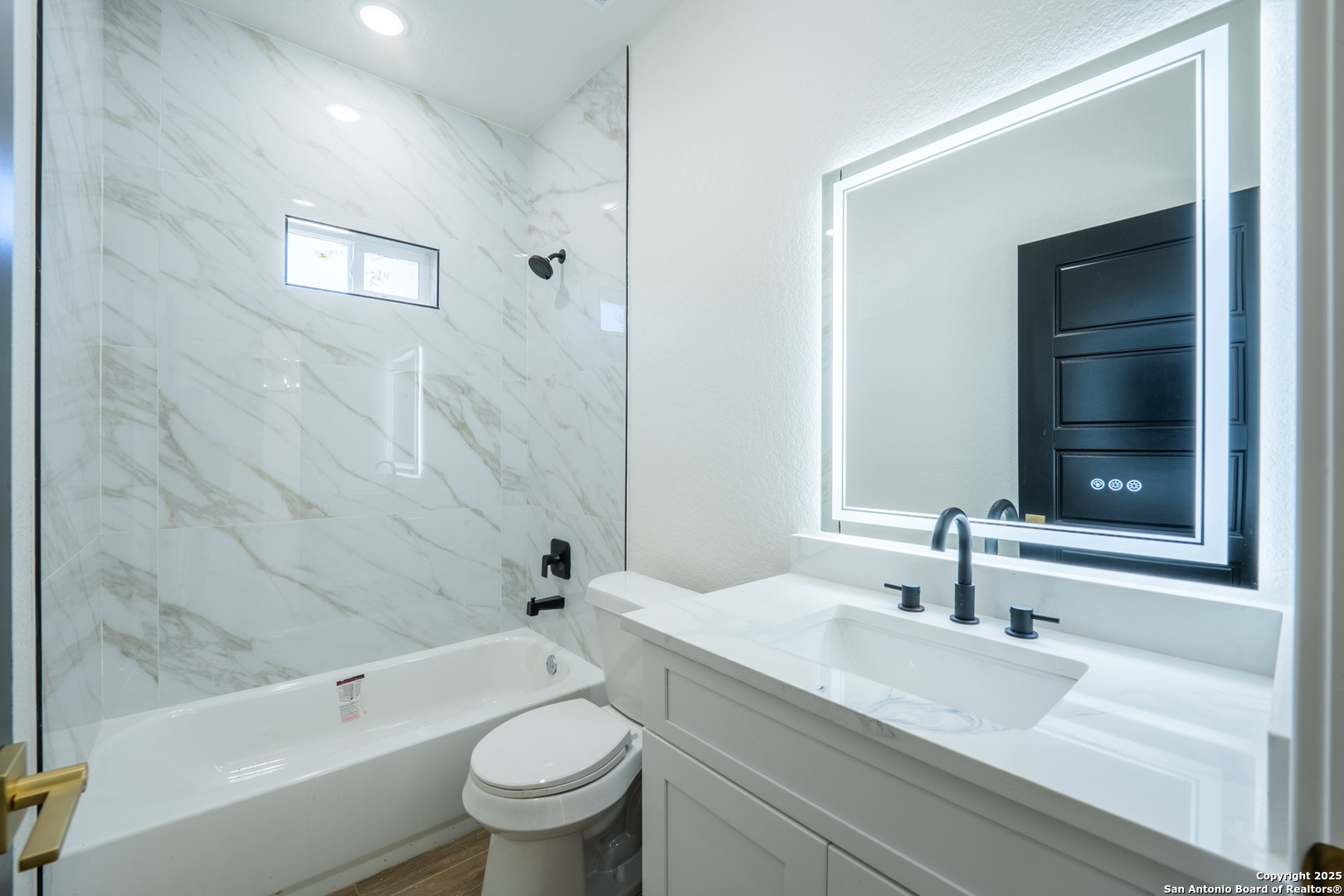 20035 Morrison Street Somerset, TX 78069 - Photo 19 of 25 a bathroom with a sink a toilet and shower