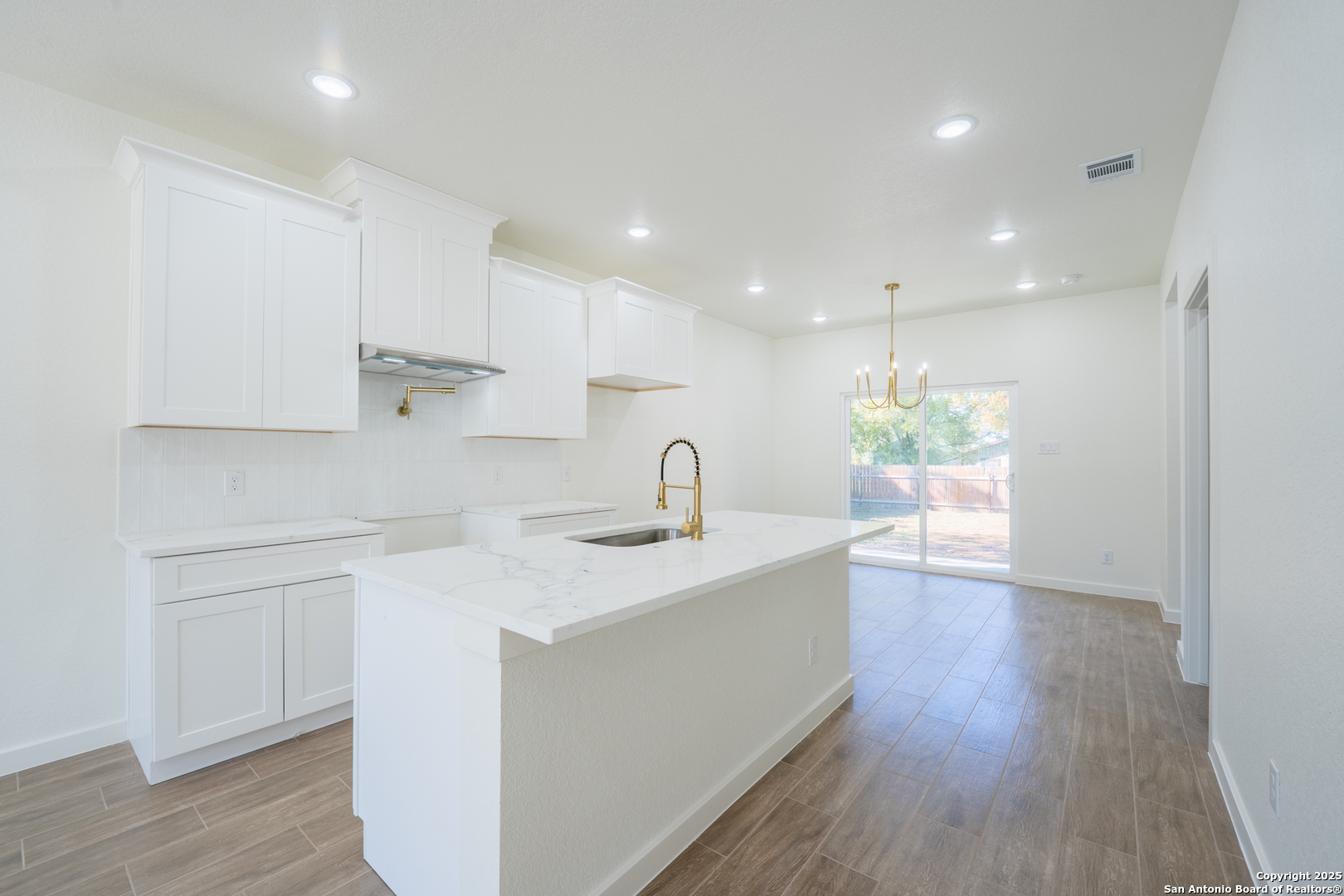 20035 Morrison Street Somerset, TX 78069 - Photo 3 of 25 a view of kitchen with sink refrigerator and window