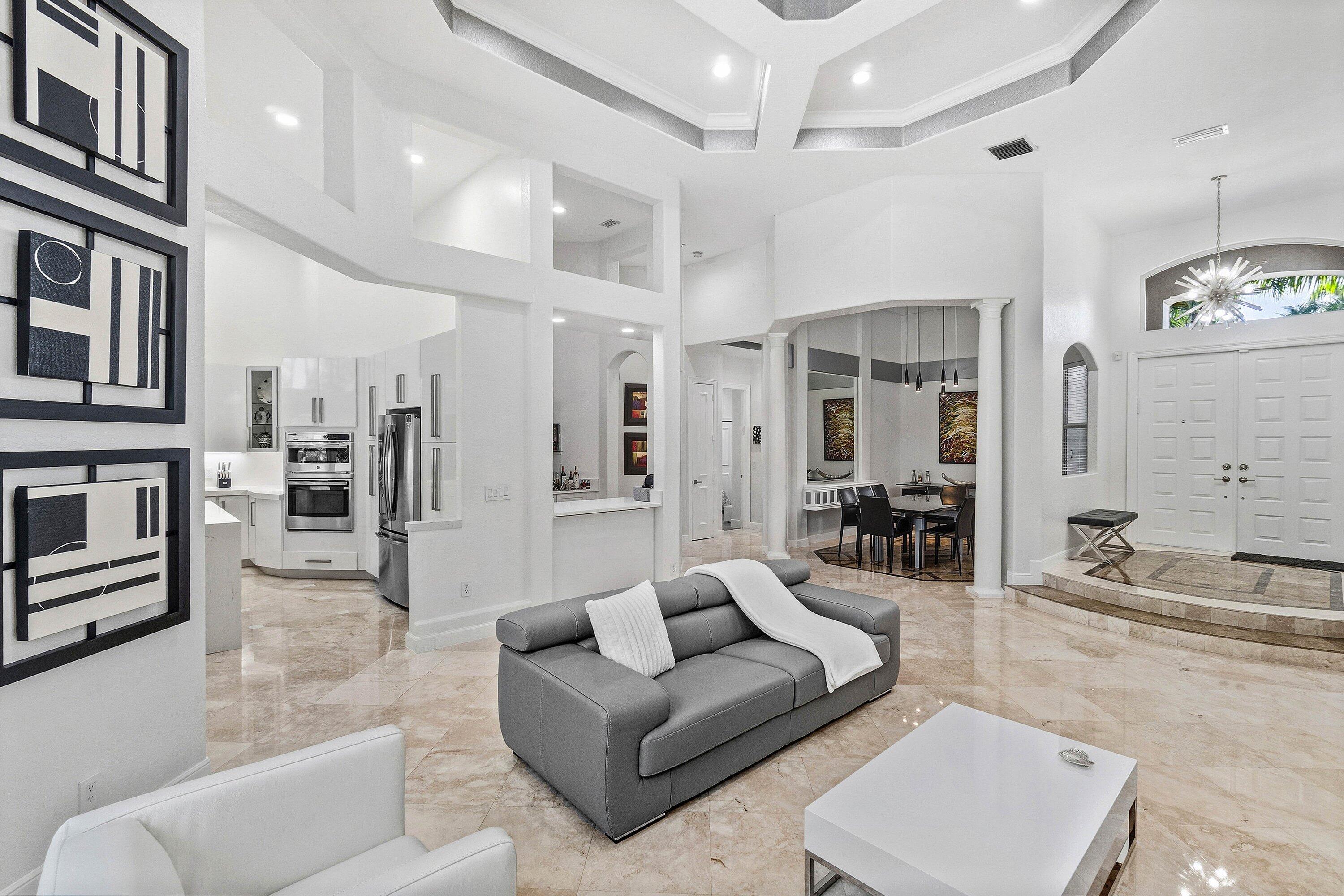 2358 Northwest 49th Lane Boca Raton, FL 33431 - Photo 12 of 47 a living room with furniture and a flat screen tv