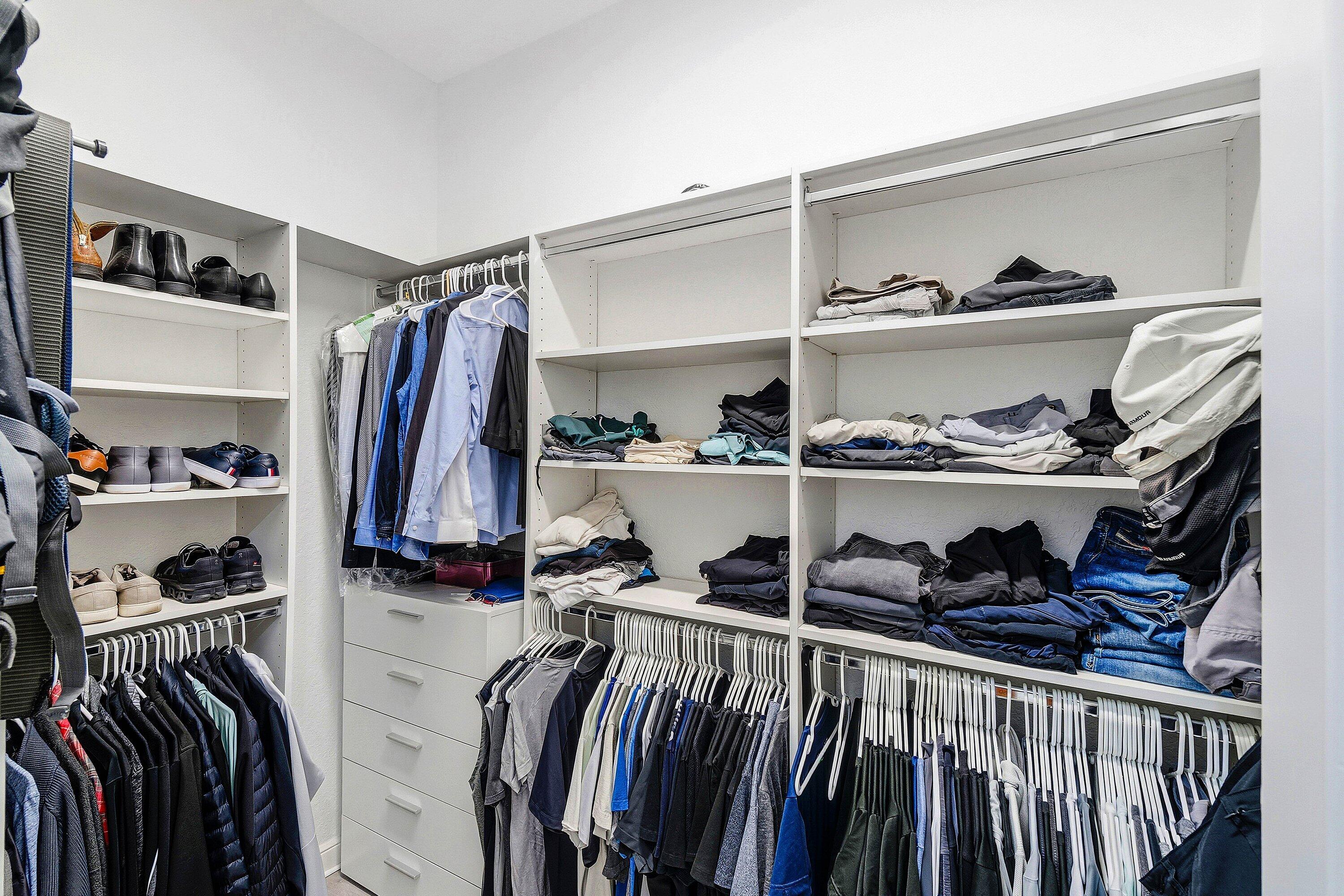 2358 Northwest 49th Lane Boca Raton, FL 33431 - Photo 24 of 47 a view of walk in closet with clothes and shoes