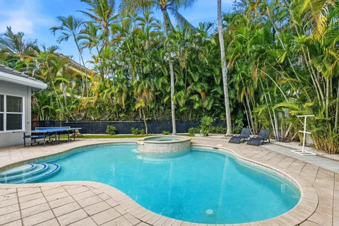 a view of a swimming pool with lounge chair